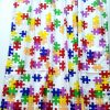 Ύφασμα λευκό με χρωματιστά puzzle